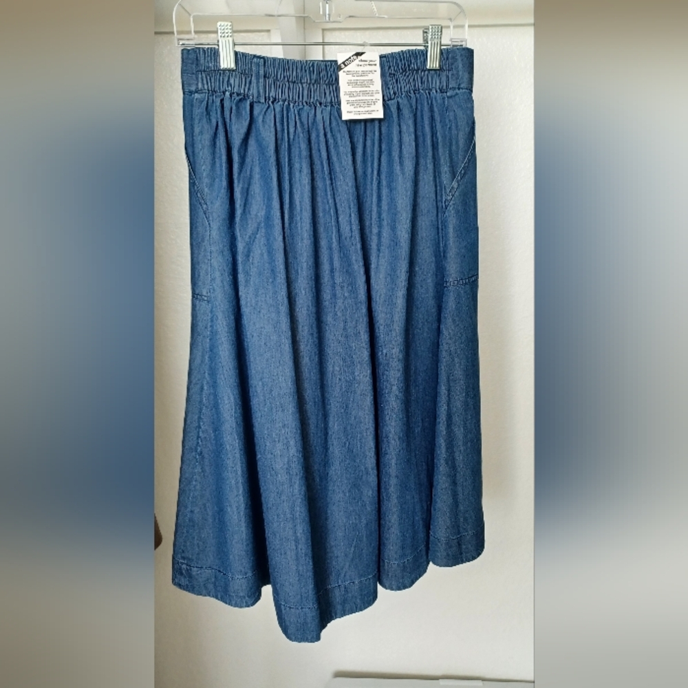 Blue A-Line Midi Skirt with 2 pockets. Length 28 inches. Waist 14.5 inches